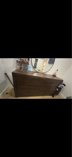 Brown dresser and tall chest
