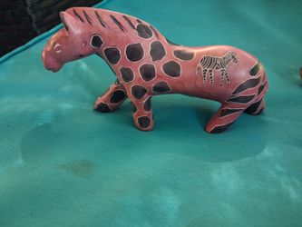 Varys animals with zebra, elephant, and giraffe carved in to them