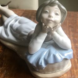 Lladro Figurine “Girl Laying Down”. 