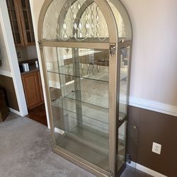 Gold brush finish curio cabinet with lighting