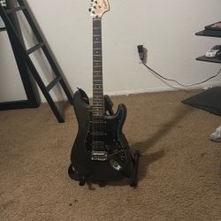 Black Fender Squier Stratacoaster Electric Guitar (With Strap) with Adjustable Guitar Stand 