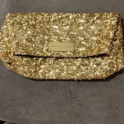 Gold sequin clutch bag