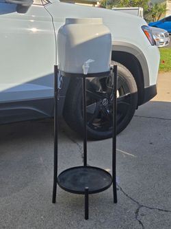 Water dispenser with stand