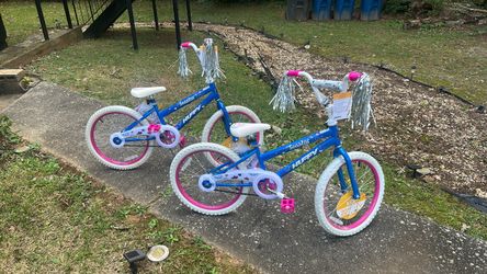 Two beautiful pink bikes