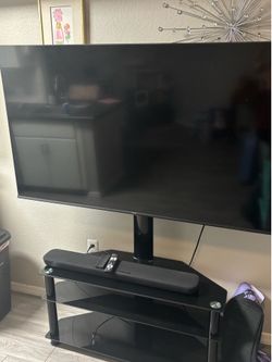 Hisense 55in with Yamaha sound bar and glass tv stand