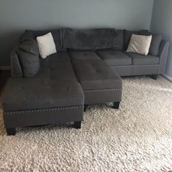Grey Couch & White Large Rug