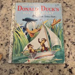 Vintage a little golden Donald Duck , toy, sailboat children’s classic book
