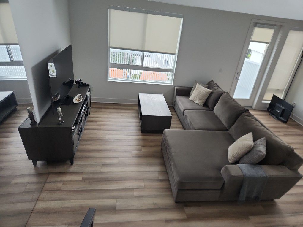 Living Spaces Sectional Sofa With TV Console And Coffee Table 