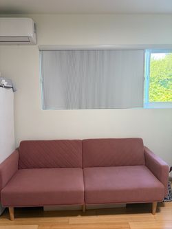 stylish pink futon that folds into full size bed
