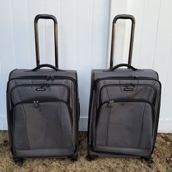 Two Samsonite grey checked rolling luggages