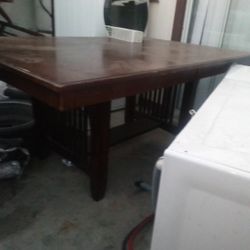 It's 2 ft 5 in high it's 3 ft 9 in with and the leaf alone us 2 ft and the table is 5 ft 6 in so with the leaf in it it's 7 ft 6 in 6 Chairs 