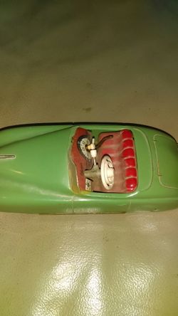 Schuco , 40's tin wind up car , everything works, windshield broke , no key.