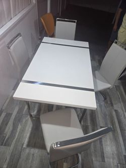 White Dining Table with Chrome Detail with chairs