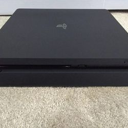 1TB PS4 Slim w/ 2 Controllers, Bluetooth Headset & Charging Doc. 