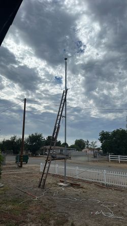Help a Navy veteran install new rope on flag pole