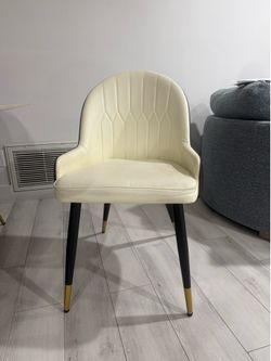 Cream and brown leather dining chairs with Gold-Tipped Legs