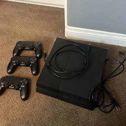 ps4 and three controllers
