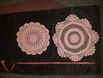 Multiple vintage hand-made doilies