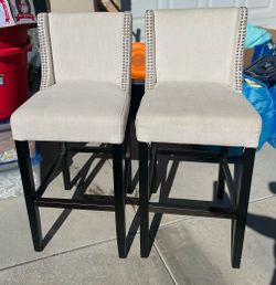 Upholstered bar stools with silver nailhead
