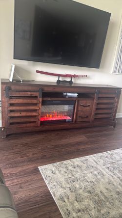 Fireplace entertainment furniture with storage and real heater