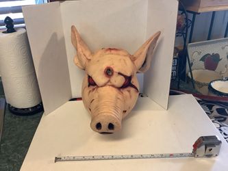 Butchered Pigs head prop solid hard rubber perfect for plays or Halloween approximately 12” tall 13” deep and about 12” wide Realistic features no iss