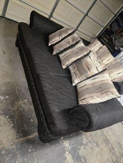 Black sofa and loveseat