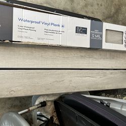 Style Waterproof Floor Covering, One Box $35.00.