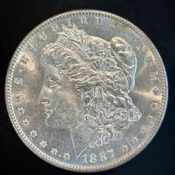1887 Morgan Silver Dollar – Nice Luster 7 Tail Feather