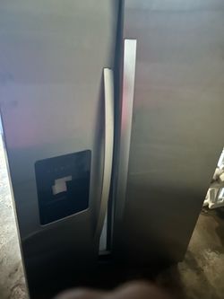 Maytag washer and large, grey double door fridge w/ ice maker