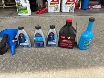 Assortment of Cleaning Formulas and Oil