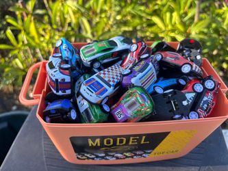 60 assorted toy cars in carrying case