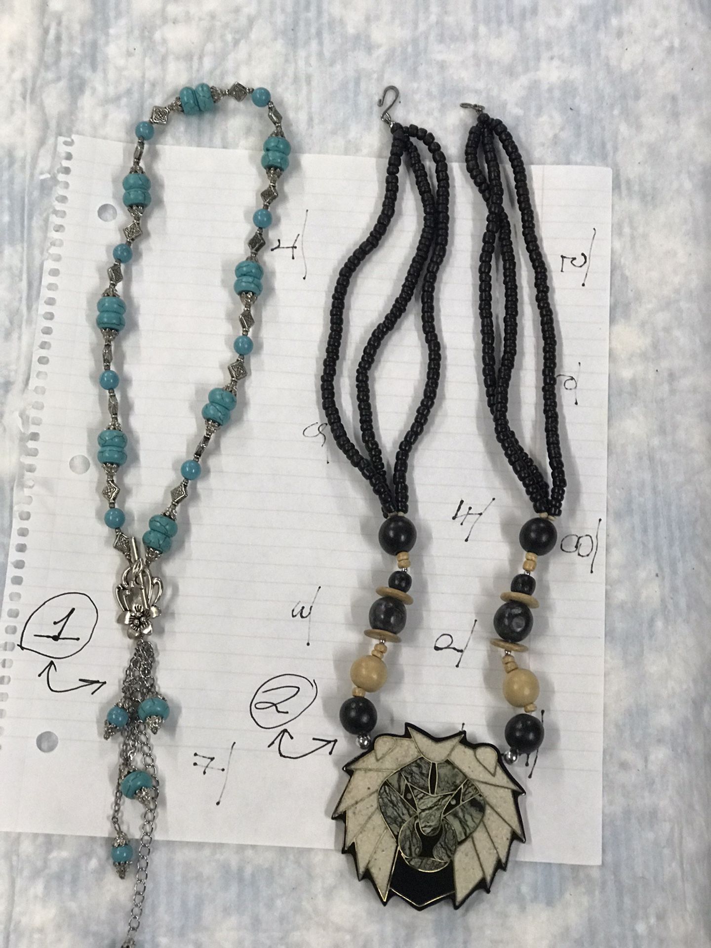 used womans neckles. with charms