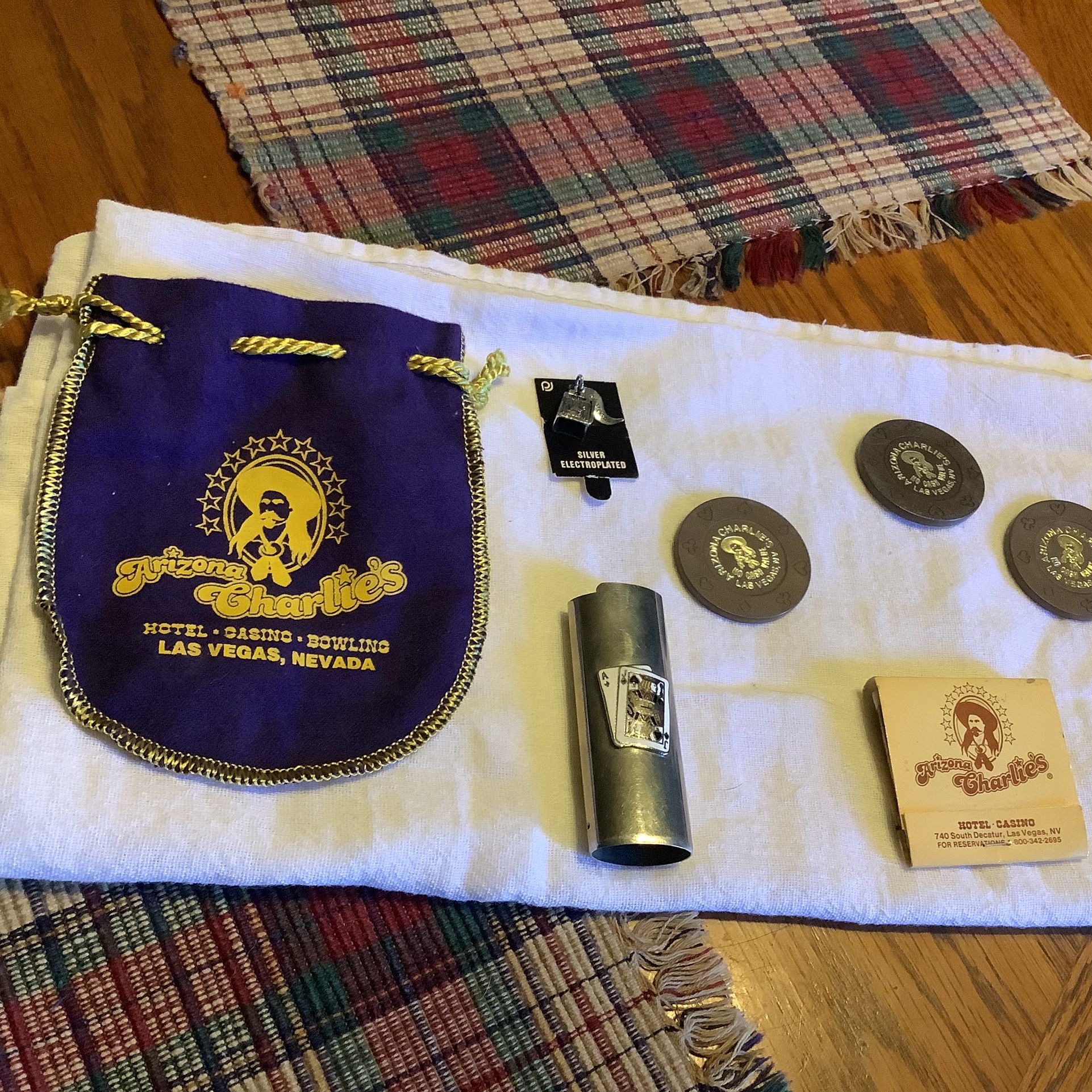 Arizona Charlies Las Vegas Casino Souvenirs 7 pieces 3 casino chips Lighter cover Charm Matchbook Crown Royal souvenir bag