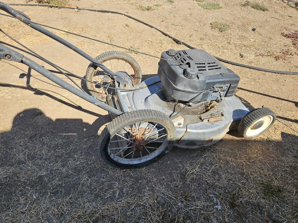 lawn mower runs good,$20.00