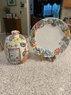 Decorative kitchen canister with matching plate