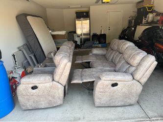 Faux leather grey couch & love seat reclines