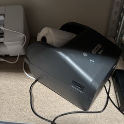 Efficient Zebra ZD421 thermal label printer. Comes with power adapter and a roll of labels inside. Great for shipping or organizing stuff