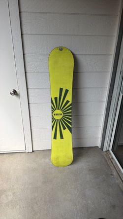 Yellow Snowboard with Sunburst Graphic