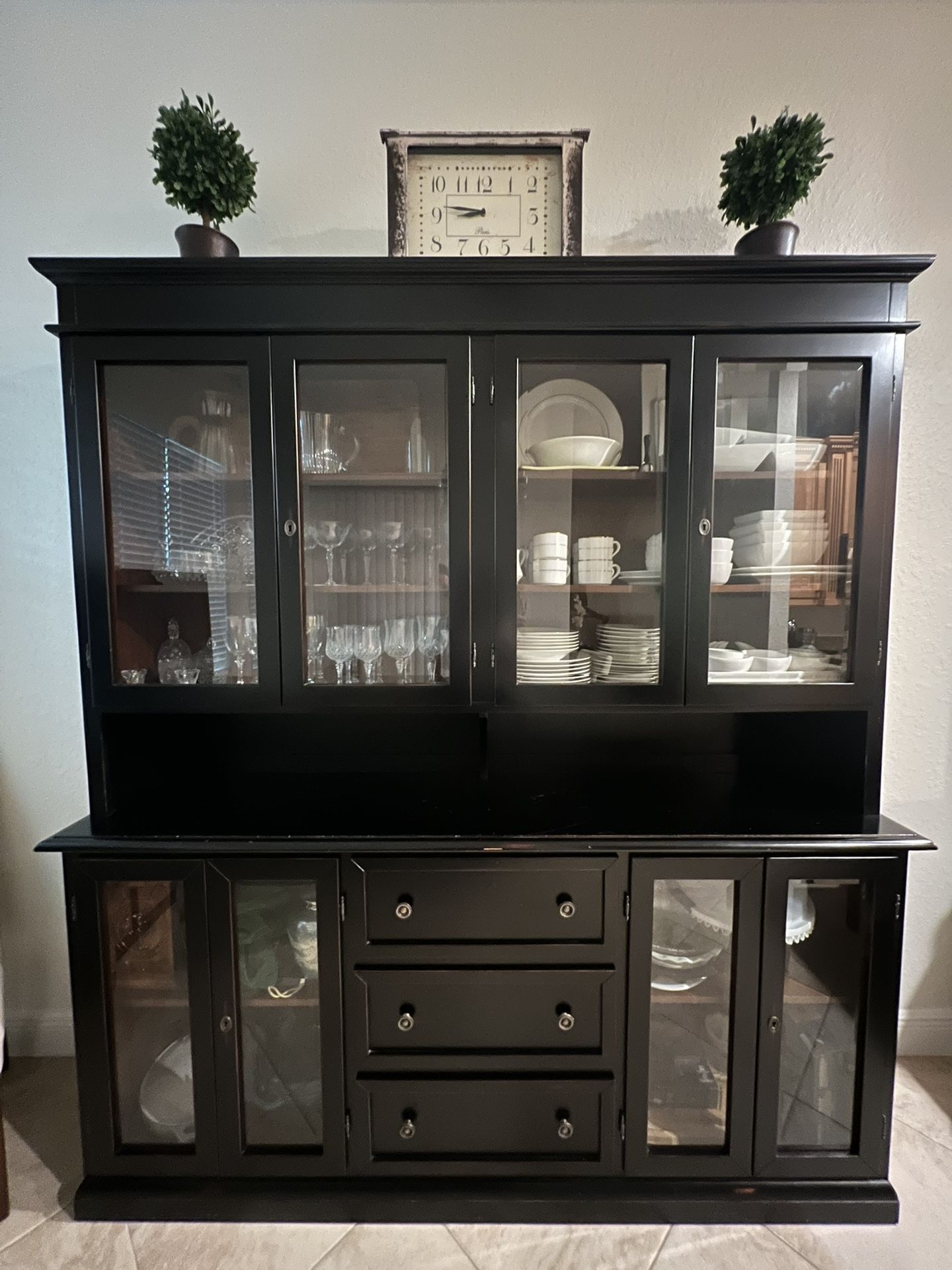 Arhaus hutch with 4 cabinets and 3 drawers.
