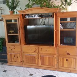Pine entertainment center with lots of storage space.
