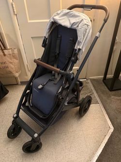 UPPAbaby stroller in navy blue with a light gray canopy