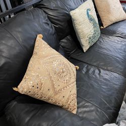 Black couch with pillows