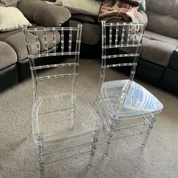 2 clear chairs
