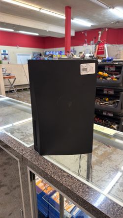 Black playstation 5 with power cord and controller