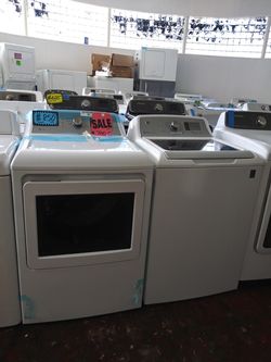 NEW scratch and dent GE top load washer and dryer set