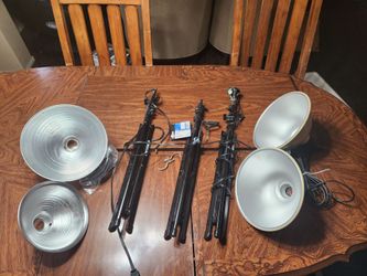 Smith-victor tripod light stands with reflectors.