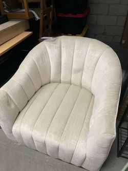 Cream spinning accent chair