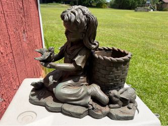 Outdoor planter little girl with basket