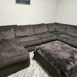 4 piece brown Ashley sectional includes ottoman