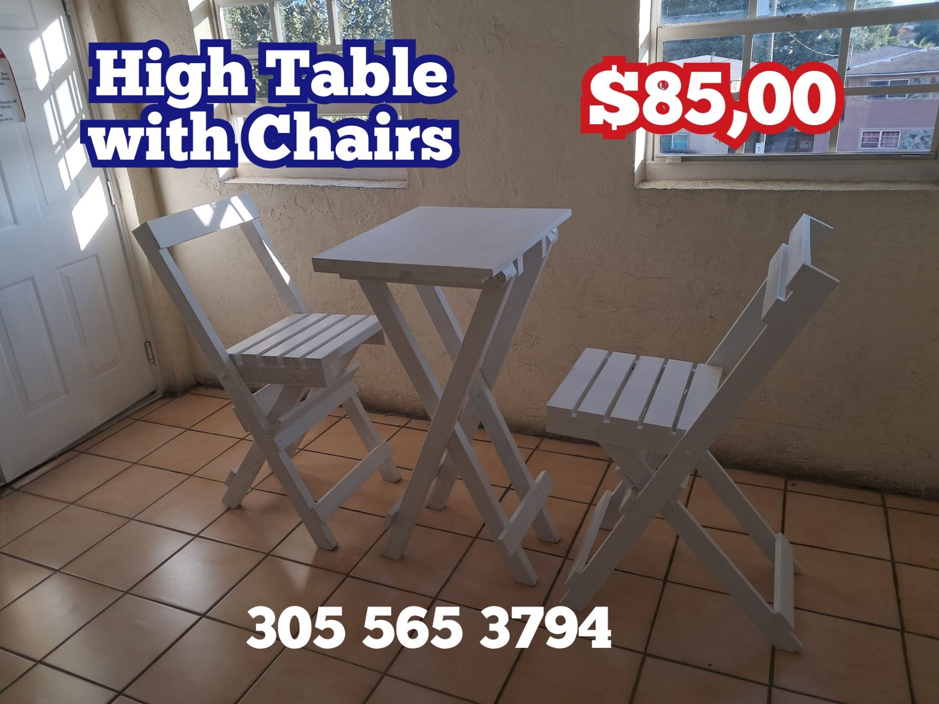 Table with two folding chairs made of wood